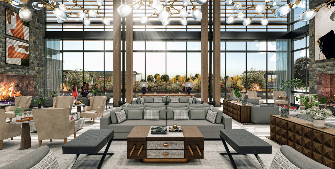 Lodge interior with floor-to-ceiling windows and stone fireplace